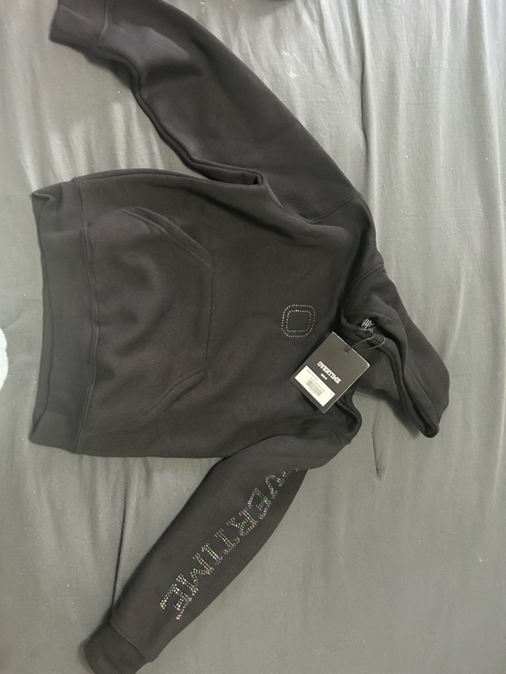 Girl’s Black Hoodie with Studded Chest Logo and Sleeve Detail.